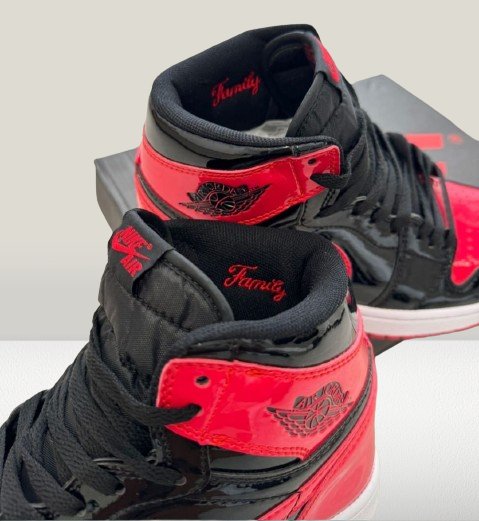 Close-up of Jordan 1 Patent-Bred heel tab and Wings logo embossing