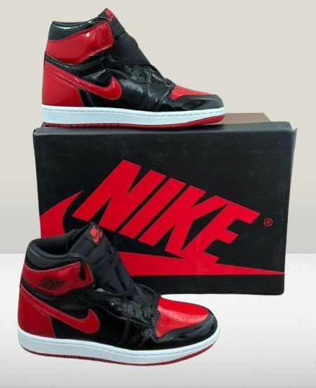 Studio shot of Air Jordan 1 Patent-Bred with Nike box