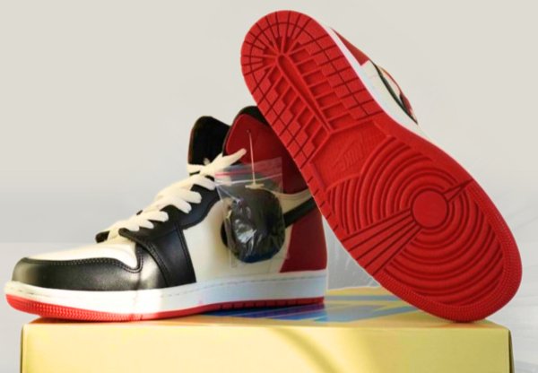 Backside view of Jordan 1 black toe sneakers