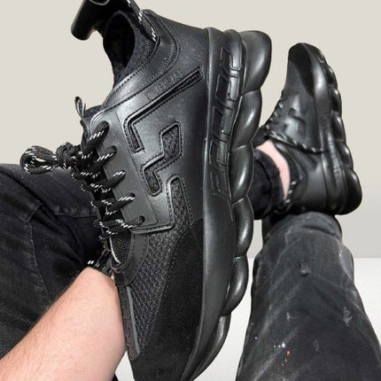 Versace Chain Reaction wearing in a foot