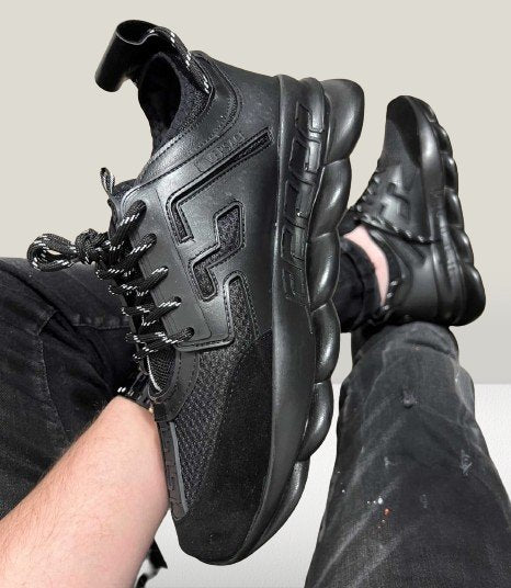 Versace Chain Reaction wearing in a foot
