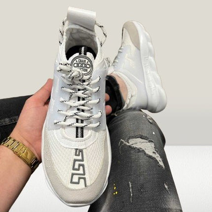 Versace Chain shoes in hand