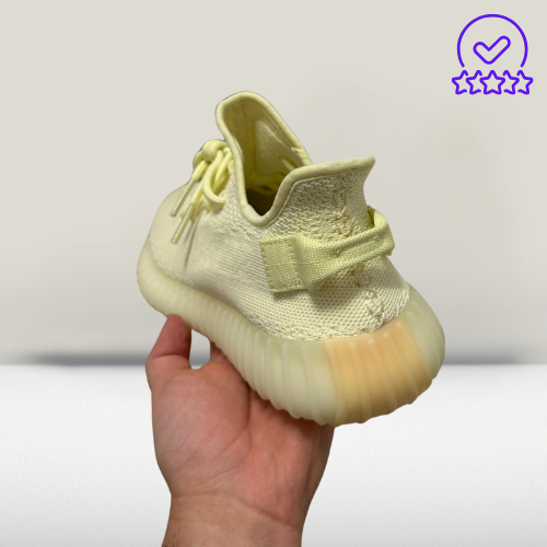 Yeezy 350 V2 Cream White sneakers styled with casual streetwear