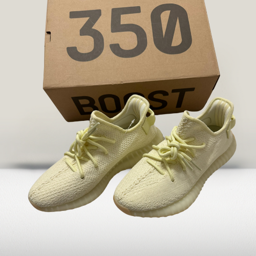 Close-up detail of Yeezy Cream White 350 V2 translucent stripe and distressed sole for urban styling